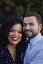 Smiling couple outdoors portrait, capturing a warm and affectionate moment.