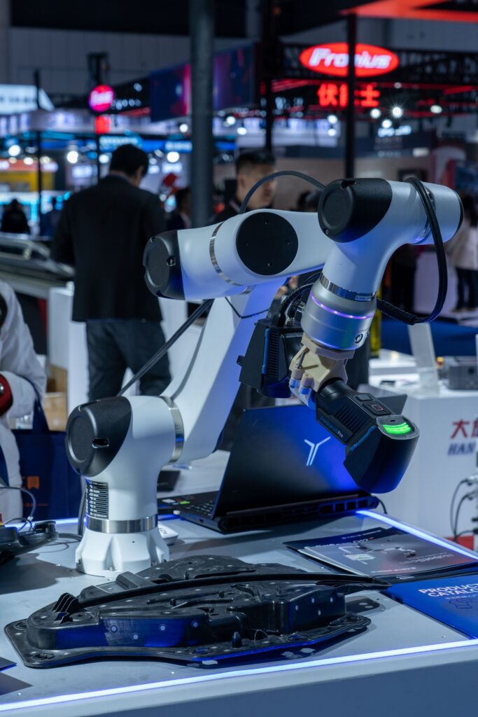 Close-up of advanced robotic arms at a technology expo showcasing automation and innovation.